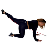 Woman doing glute kickbacks with the Van Esther Resistance Band Set